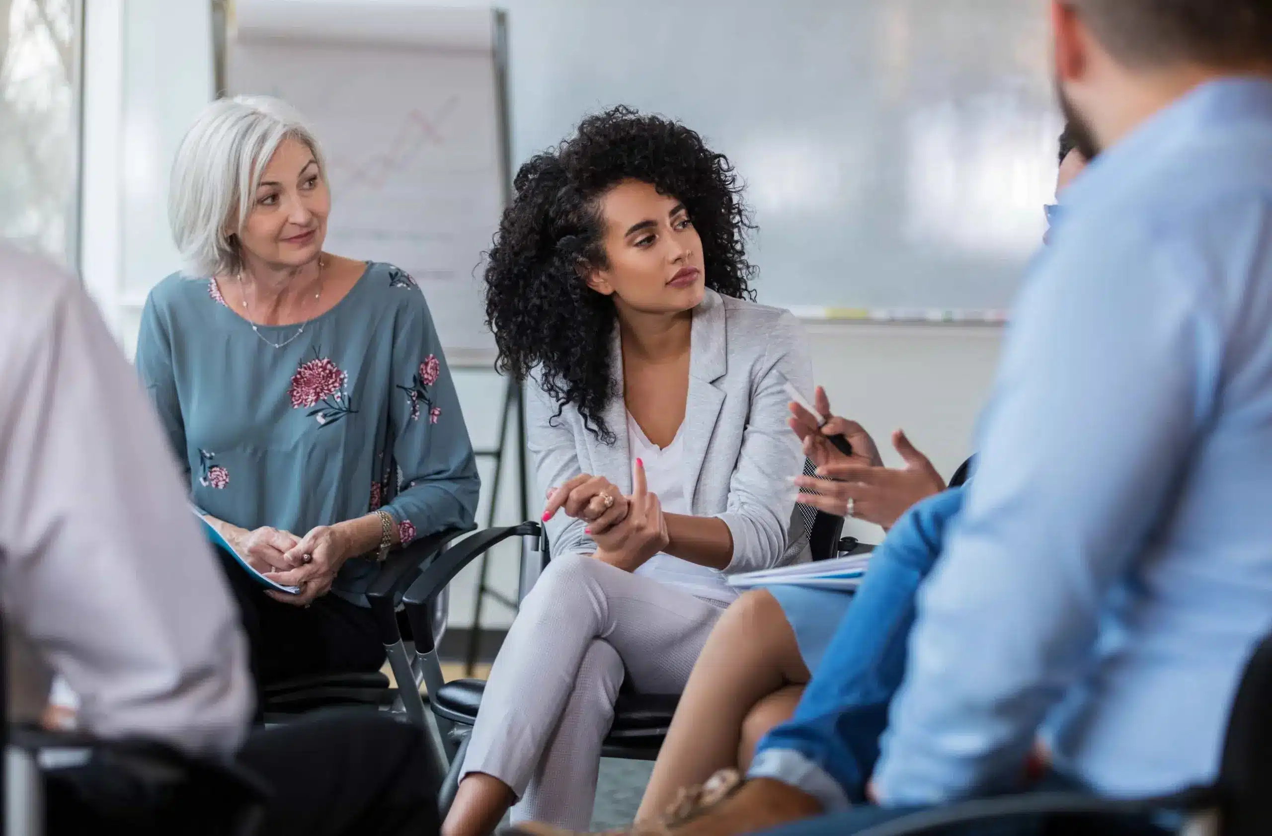 Diverse group participates in a team building workshop fostering collaboration and communication in a business setting