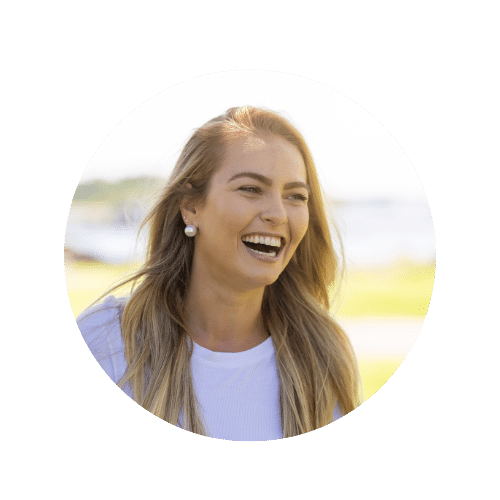 Happy blonde woman smiling detox program participant Natural light outdoor setting promoting womens wellness and health