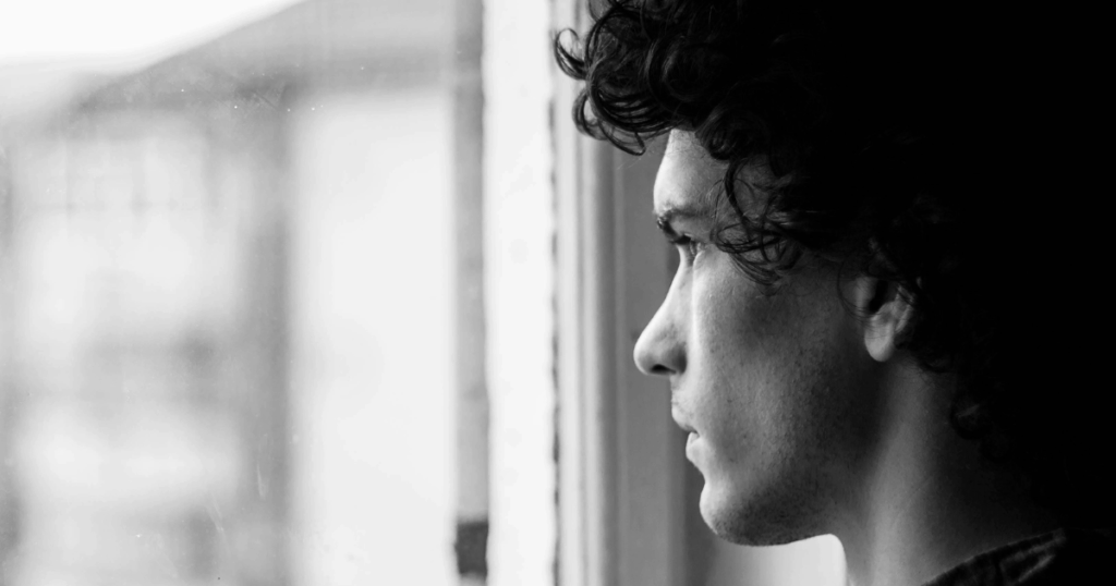 image Silicon Valley Recovery Black and white portrait of a thoughtful man looking out the window relevant to frotteuristic disorder