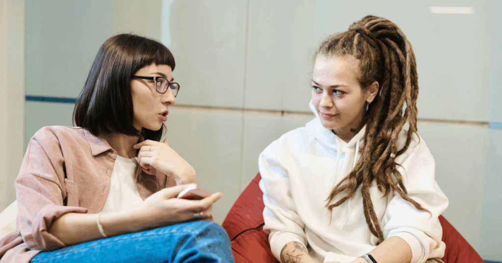 Two women discussing Ritalin withdrawal coping strategies offering support and understanding in a casual setting