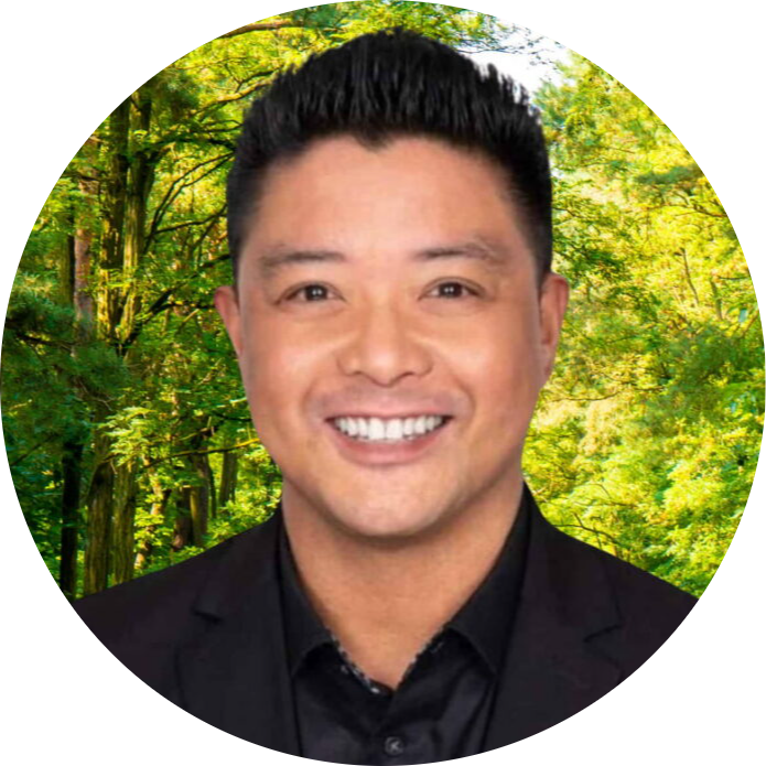 jerry7 Silicon Valley Recovery Silicon Valley Recovery Head and shoulders portrait of a smiling man in a black suit against a green forest background circular crop